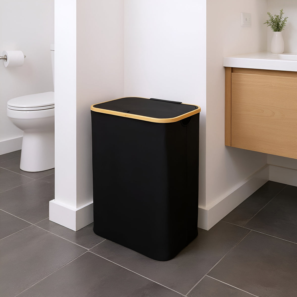 Black bamboo frame laundry hamper in modern bathroom