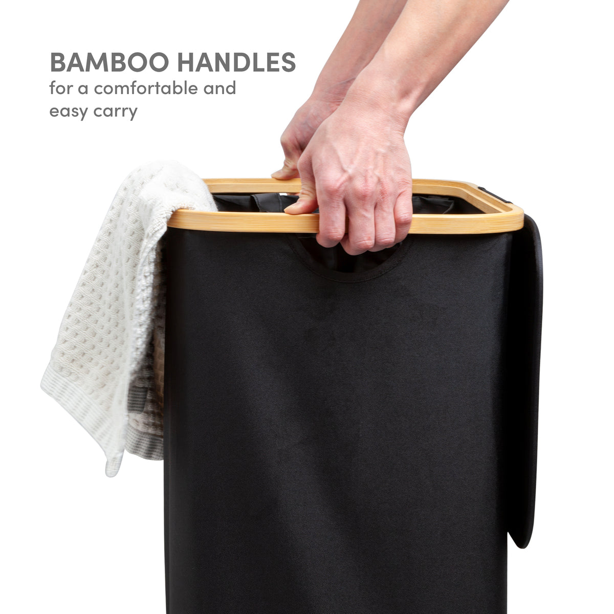 Bamboo handles on black laundry hamper for easy carrying