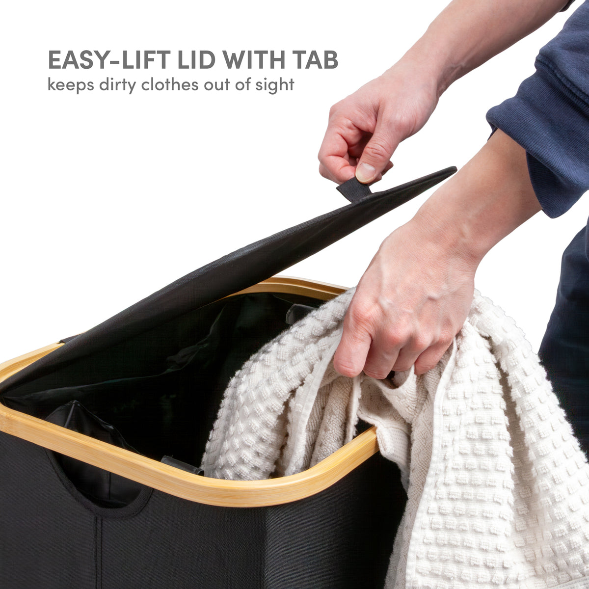Easy-lift lid with pull tab on black laundry hamper