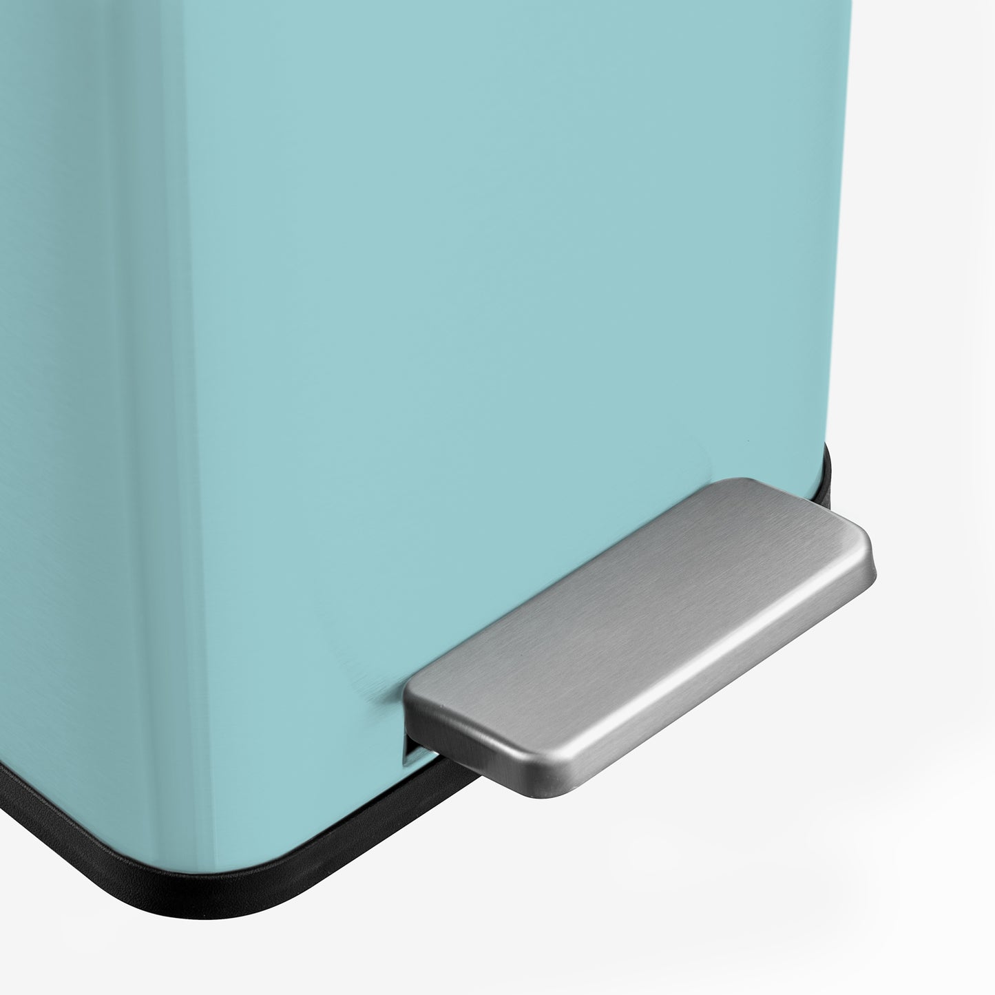 Hands-free step pedal on baby blue bathroom trash can