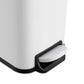 Hands-free step pedal on small white trash can