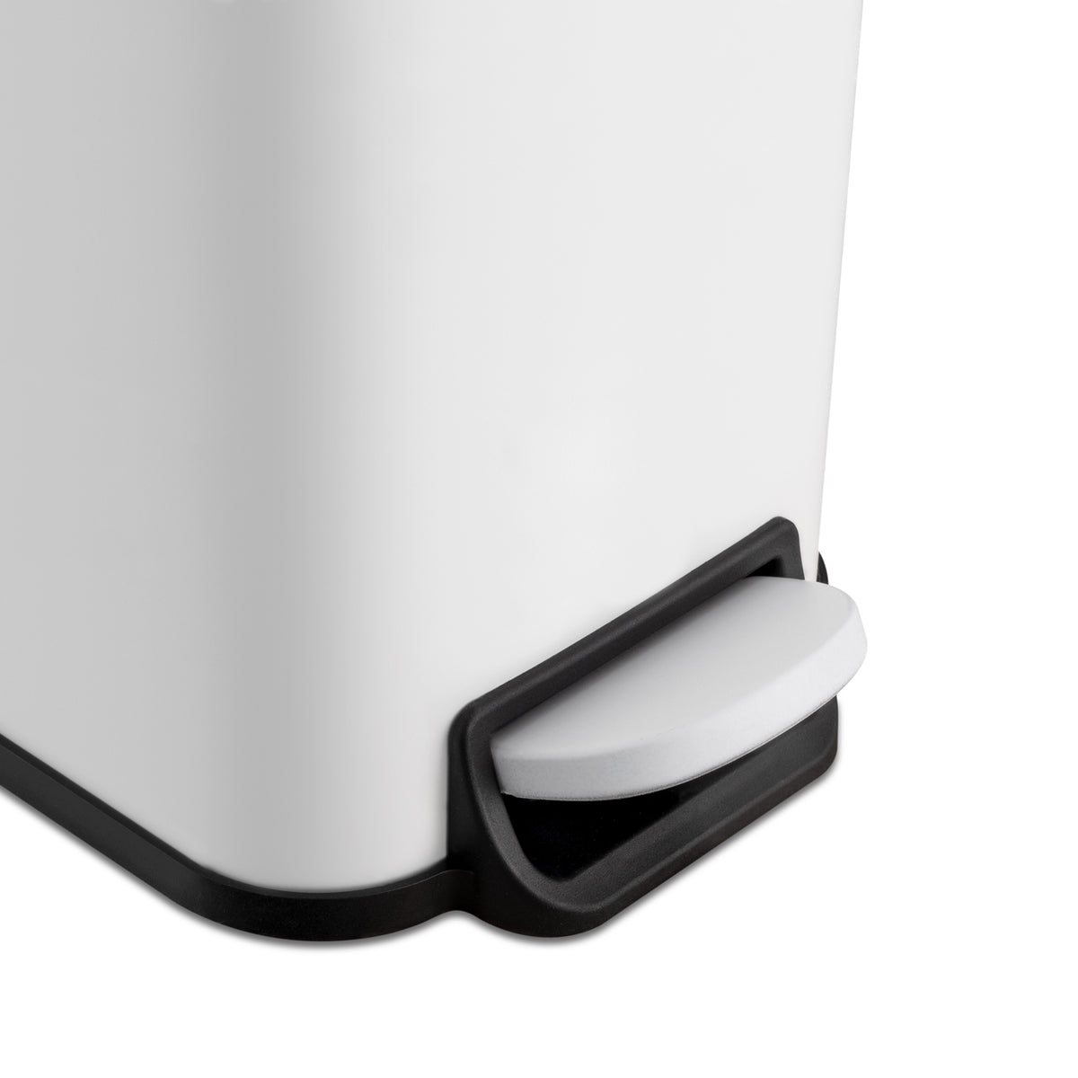 Hands-free step pedal on small white trash can