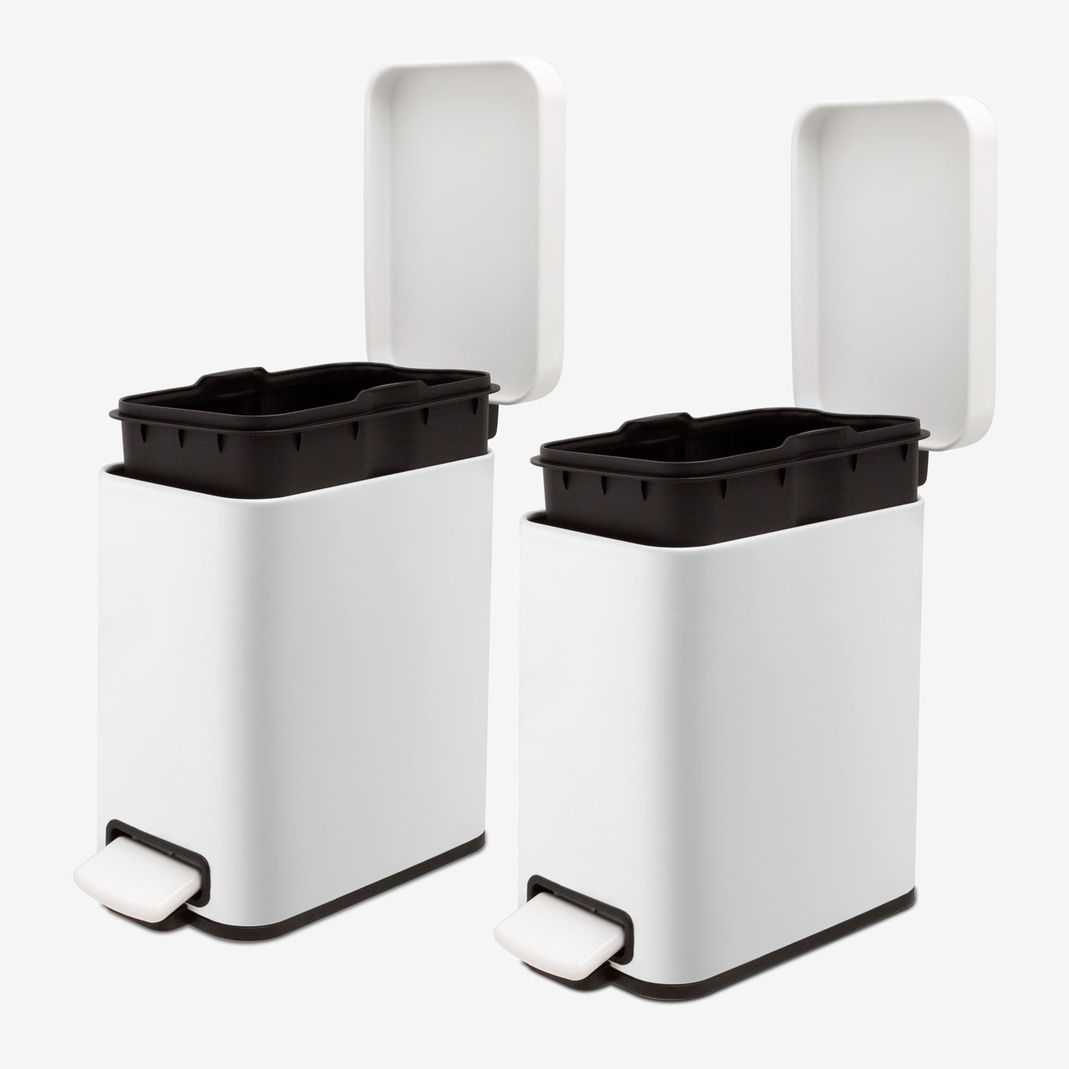 Removable inner buckets inside two small white bathroom trash cans