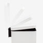 Soft-close lid mechanism on small white step trash can