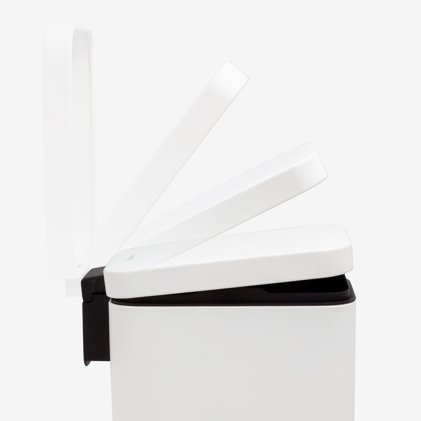 Soft-close lid mechanism on small white step trash can