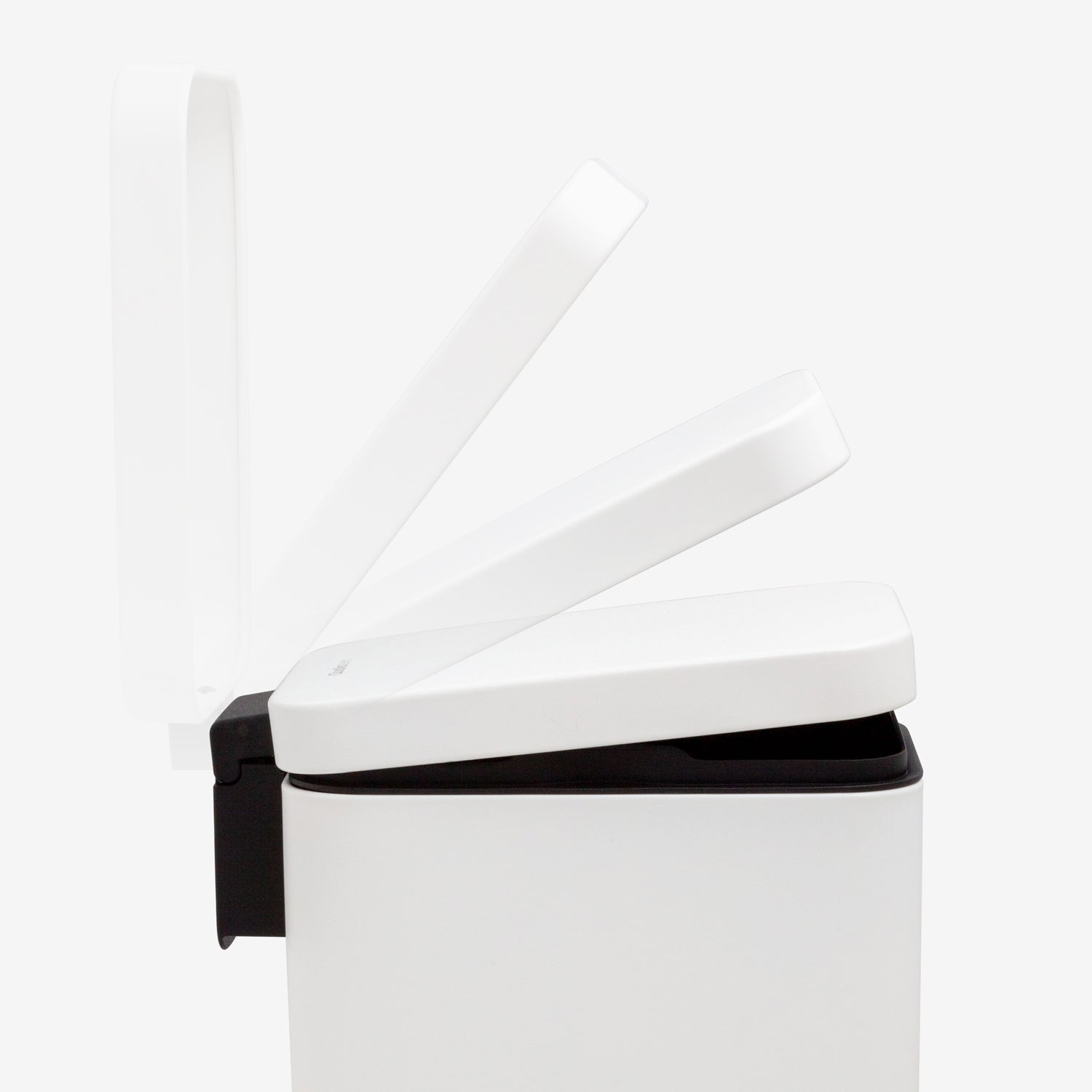 Soft-close lid mechanism on small white step trash can