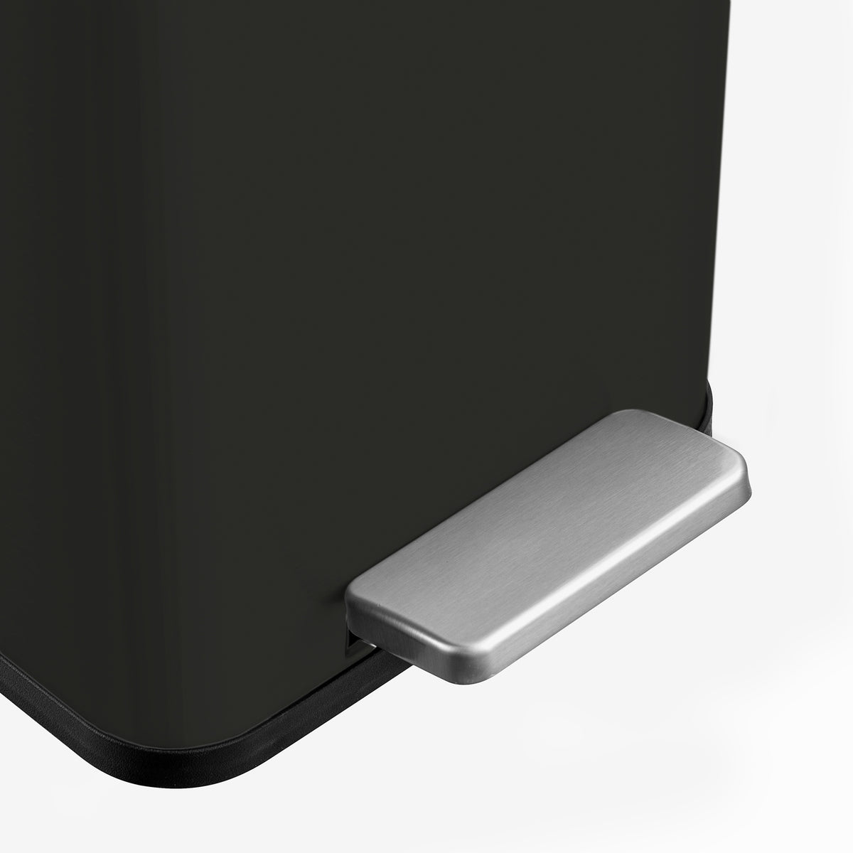 Stainless steel hands-free pedal on black slim trash can