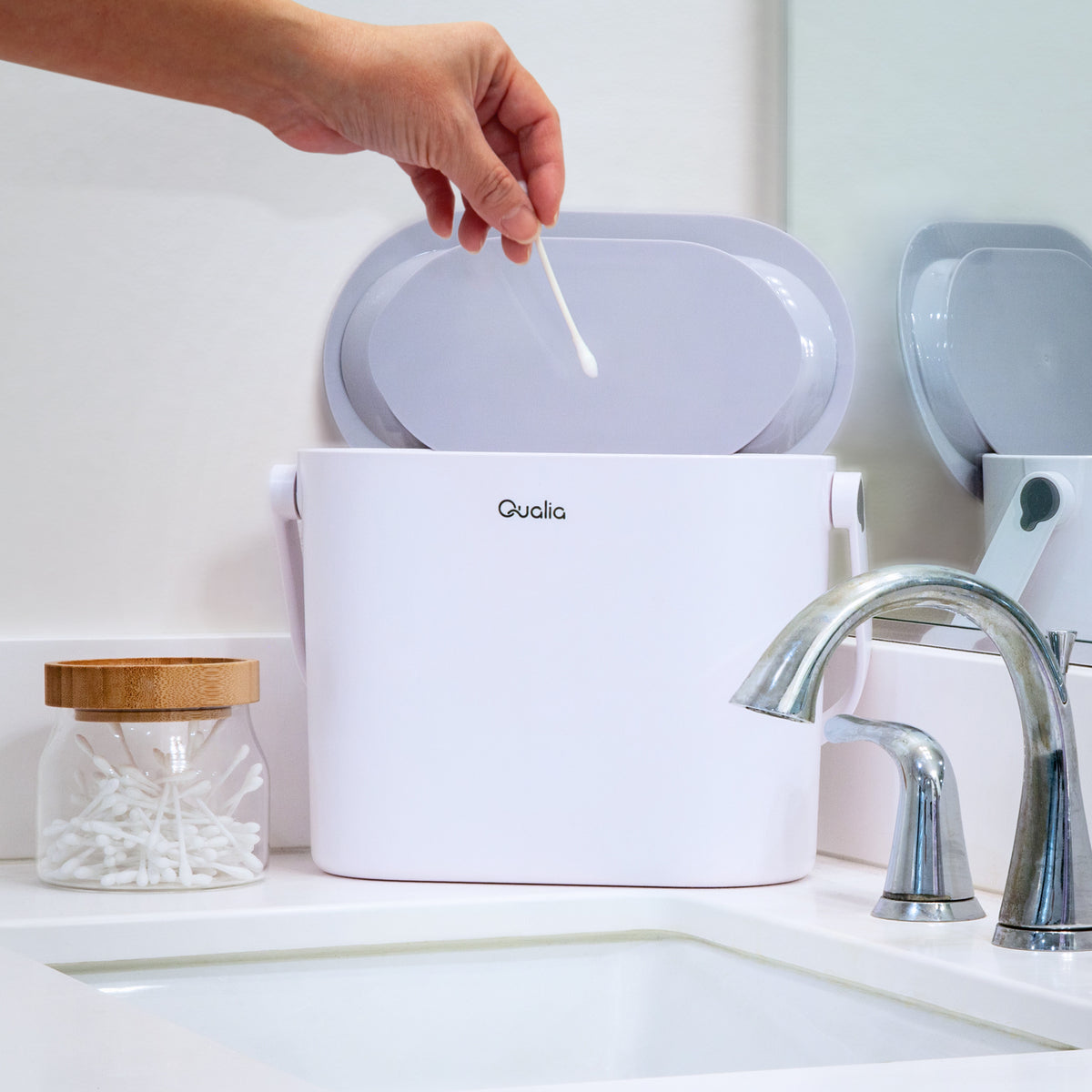 Compact ABS countertop compost bin beside a kitchen sink