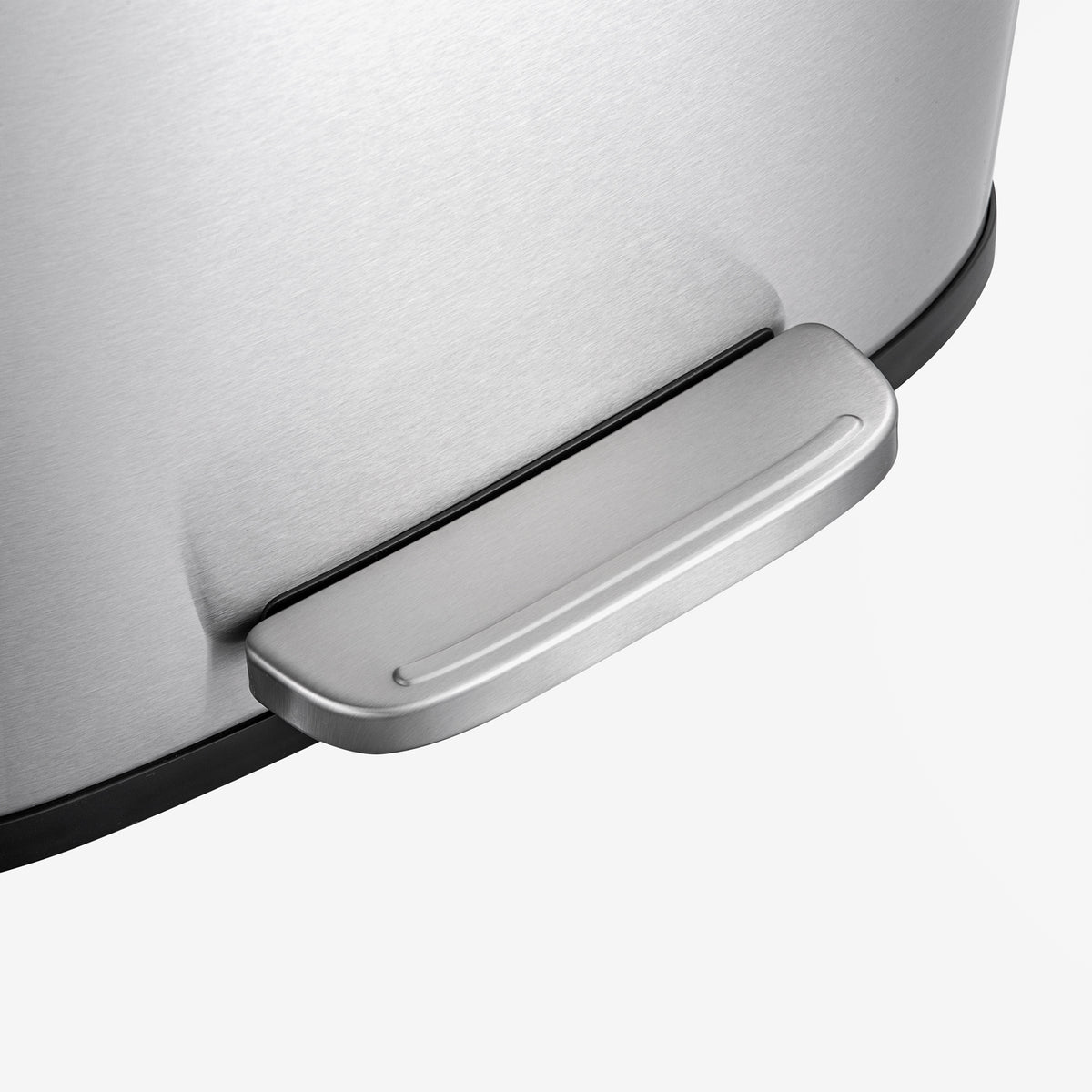 Hands-free foot pedal on stainless steel trash can