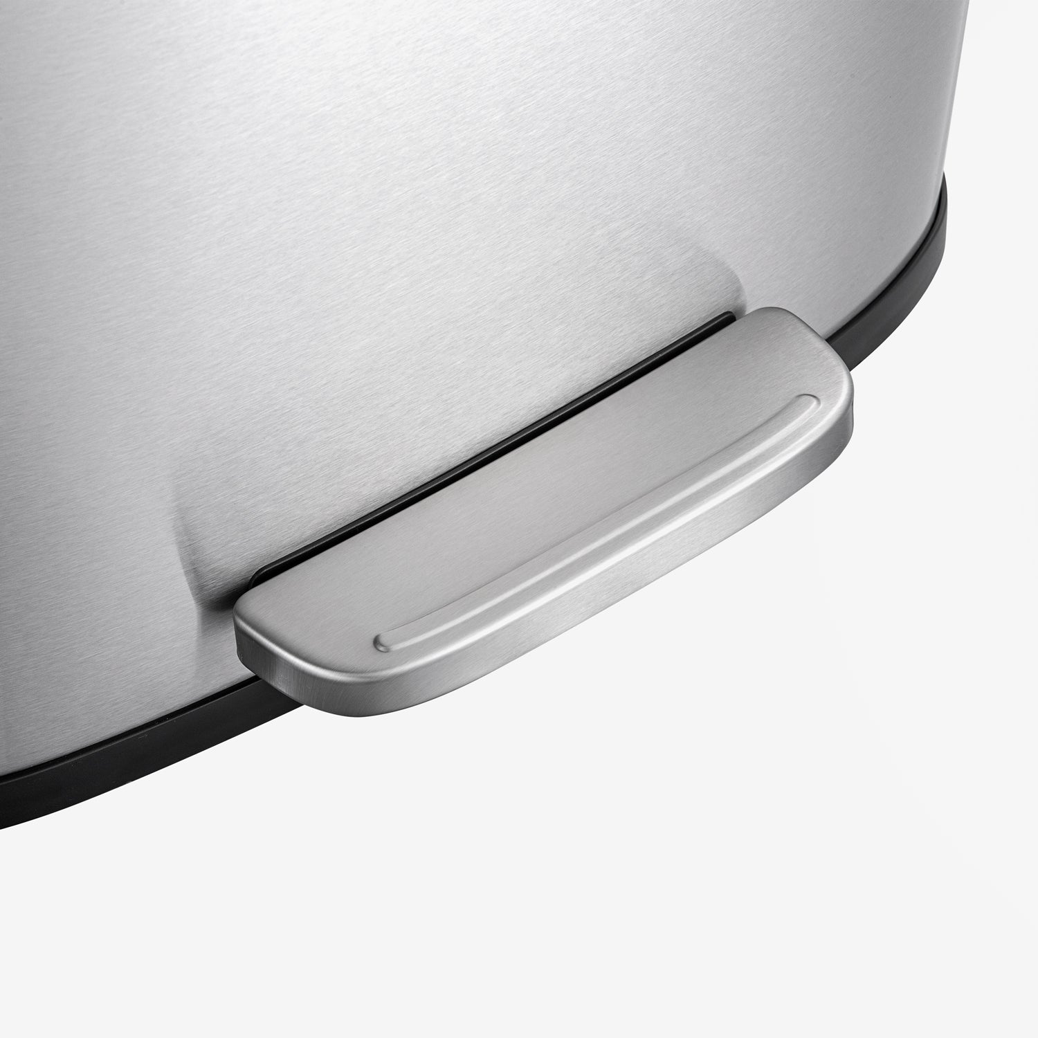 Hands-free foot pedal on stainless steel trash can