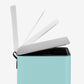 Soft-close lid on small baby blue step trash can