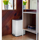 White slim step trash can fitting neatly in a narrow household space